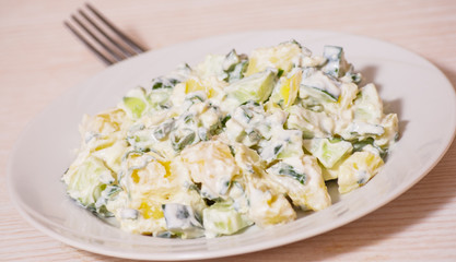 Potato salad with green onions and cucumber