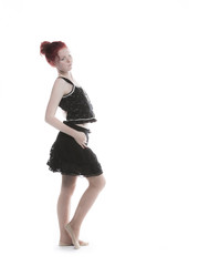 Young lady with red hair in studio