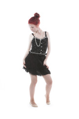 Young lady with red hair in studio