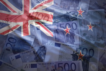 colorful waving new zealand flag on a euro money background