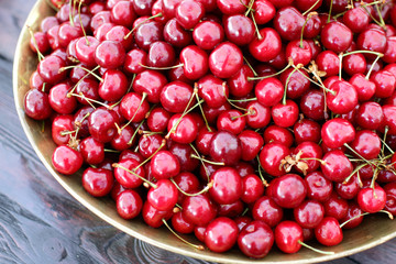 dish with fresh cherries closeup