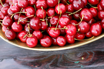 dish with fresh cherries closeup