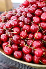 dish with fresh cherries closeup