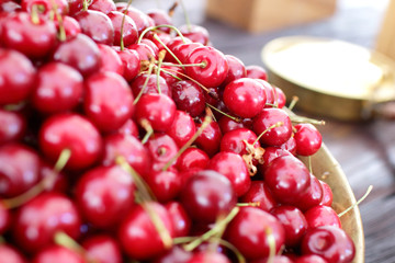 dish with fresh cherries closeup