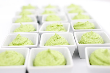 butter mixed with herbs in small plates at the buffet