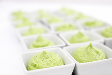 butter mixed with herbs in small plates at the buffet