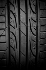 Winter tires close-up on background