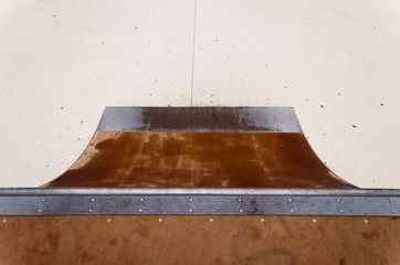 Quarter pipe in skate-park.