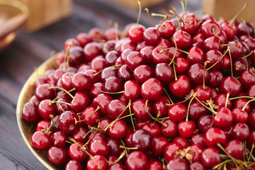 dish with fresh cherries closeup