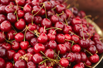 dish with fresh cherries closeup