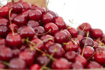 dish with fresh cherries closeup