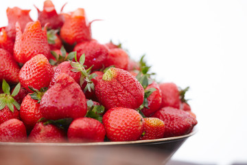 dish with fresh strawberries closeup