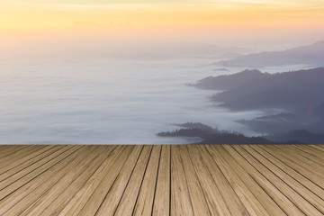 Fototapeta na wymiar wood terrace with view of Huai Nam Dang national park in the morning with sea of mist ,Thailand for background 