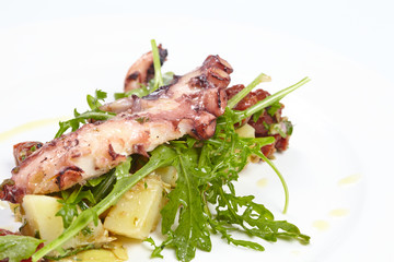 octopus with potatoes, arugula