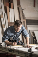 Young woodworker working in carpentry