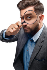 Man with magnifying glass on white background