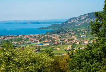 Fototapeta na wymiar Garda lake and Garda city views from the hills