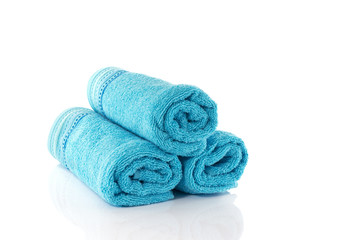 Fototapeta na wymiar three rolled towels