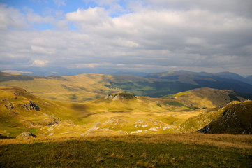 Photography of yellow and green hills with lights and shadows