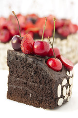 Chocolate cake with cherries.