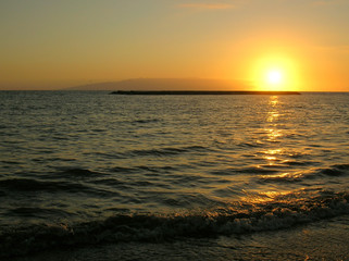 Ocean sunset with reflection on the water.