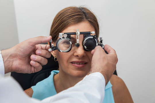 Ophthalmologist putting special lenses
