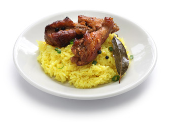 chicken and pork adobo over yellow rice, filipino food isolated on white background