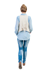 Fototapeta premium back view of walking woman.