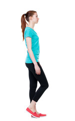 Fototapeta na wymiar side view of walking woman in sports tights.