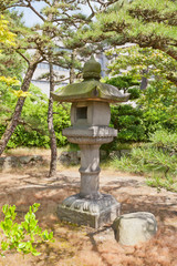 Traditional stone lantern (toro) in Takamatsu castle, Japan