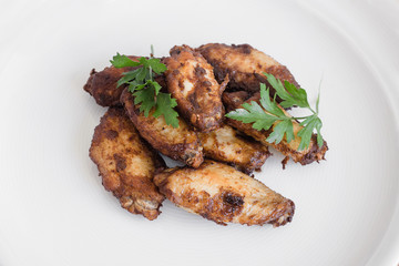 Barbecue chicken wings on white plate