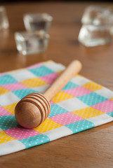 honey spoon on a wooden table