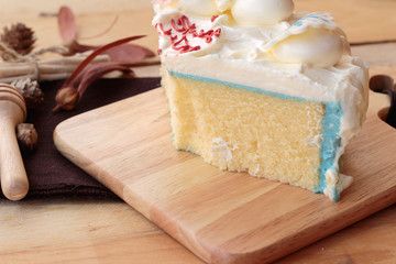 White cream cake delicious on wood background