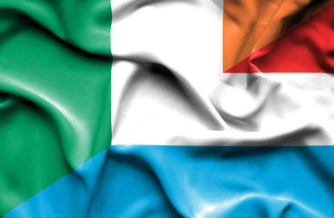 Obraz premium Waving flag of Luxembourg and Ireland
