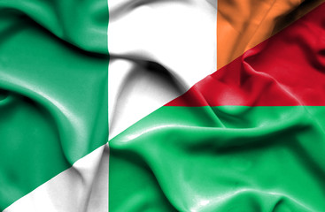 Obraz premium Waving flag of Madagascar and Ireland