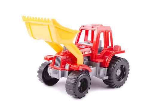 red toy tractor on a white background