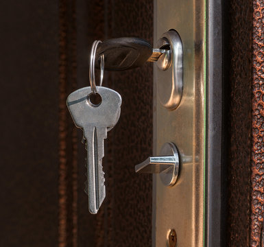 The keys in the lock of a metal door