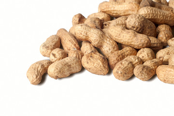 Peanuts heap isolated on white background