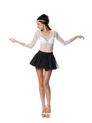 Portrait of a beautiful slim model in black skirt and white blou