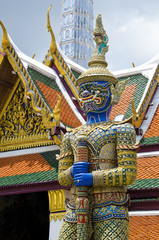 Giant golden statue at Emerald Buddha Temple, Bangkok, Thailand