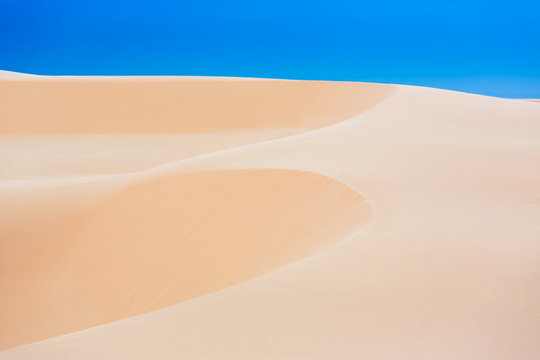 White sand dunes with blue skies, Mui Ne, Vietnam
