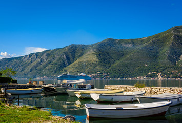 Fototapeta na wymiar Harbour and boats at Boka Kotor bay (Boka Kotorska), Montenegro, Europe.
