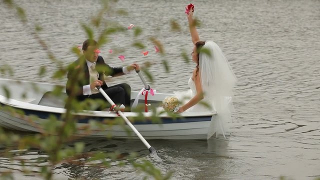 Newlyweds Ride In a Boat