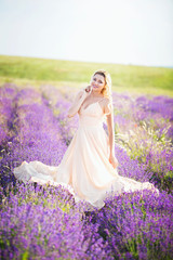 Portrait of a beautiful girl on the lavender field.
