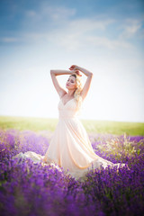 Portrait of a beautiful girl on the lavender field.