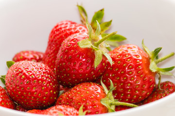 close up of bowl with ripe strawberries