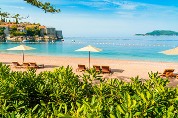 Obraz premium Beautiful beach with sunshades in Montenegro, Balkans, Adriatic Sea.