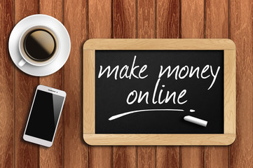 coffee, phone and chalkboard with make money online words