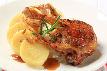Roast duck with potato dumplings and white cabbage