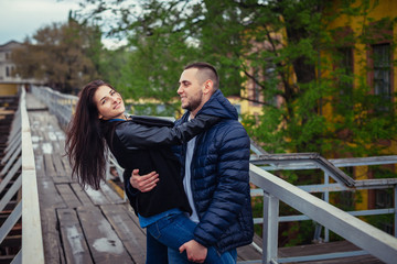 Beautiful young couple in love on a date outdoors on modern urba